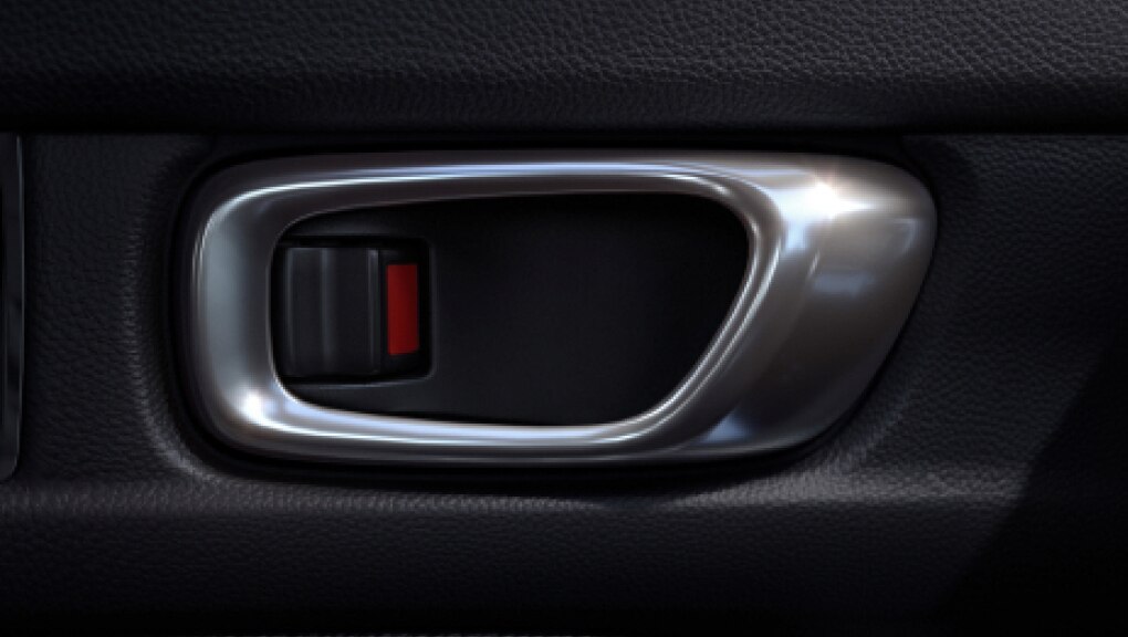 Close-up of silver-coloured Honda Civic Hatchback doorhandle against a black interior