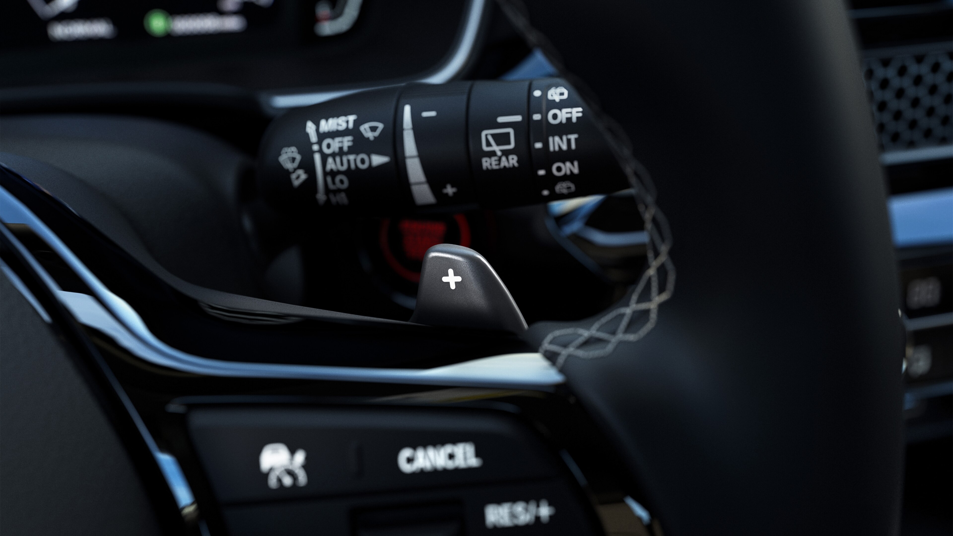 Close-up of controls on right side of a Honda Civic Hatchback steering wheel