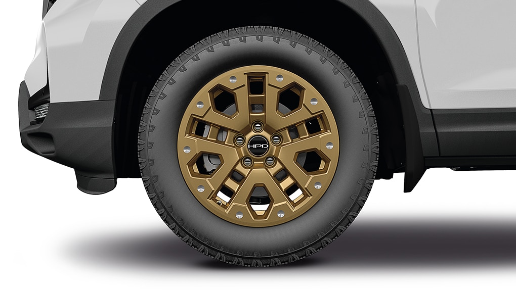 Profile view 18-inch bronze alloy wheel on the Ridgeline on white background.  