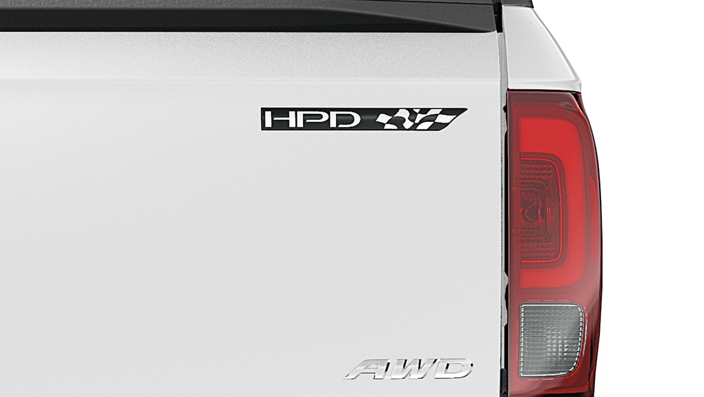 Rear view of Ridgeline tailgate with HPD emblem.