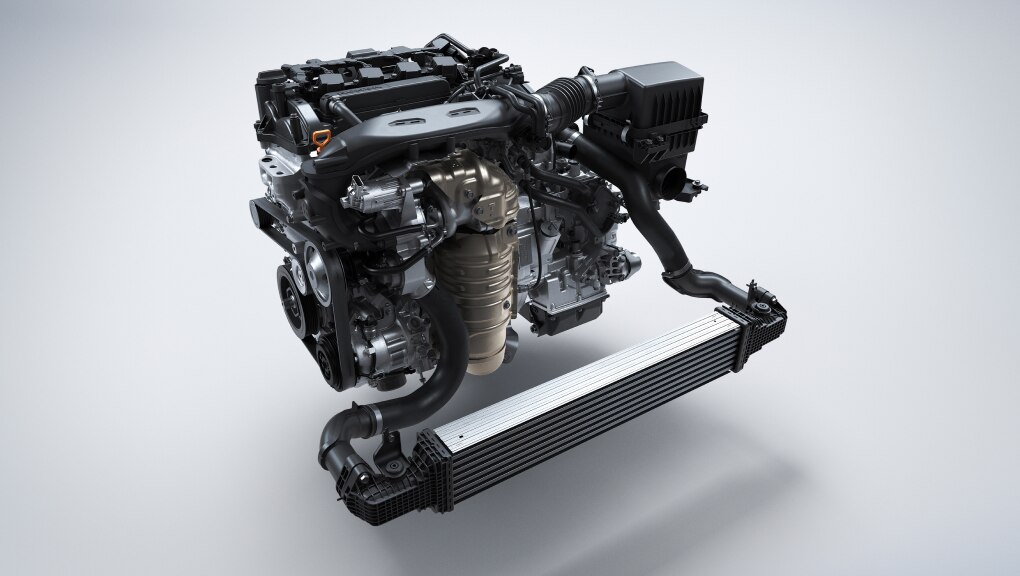 Front of isolated Honda Civic Hatchback engine on a grey background