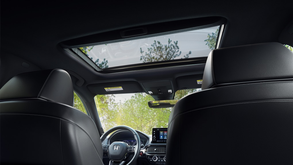 Interior view of Honda Civic Hatchback console and moonroof from the back seat