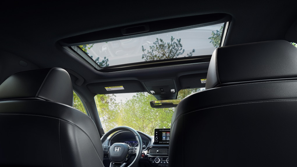 Interior view of Honda Civic Hatchback console and moonroof from the back seat