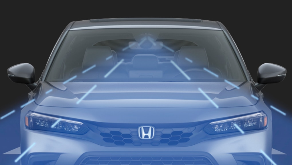 Forward-facing front end of a white 2022 Honda Civic in a black background with sensor technology depicted in the form of a wide beam cast out from the car’s new front camera.