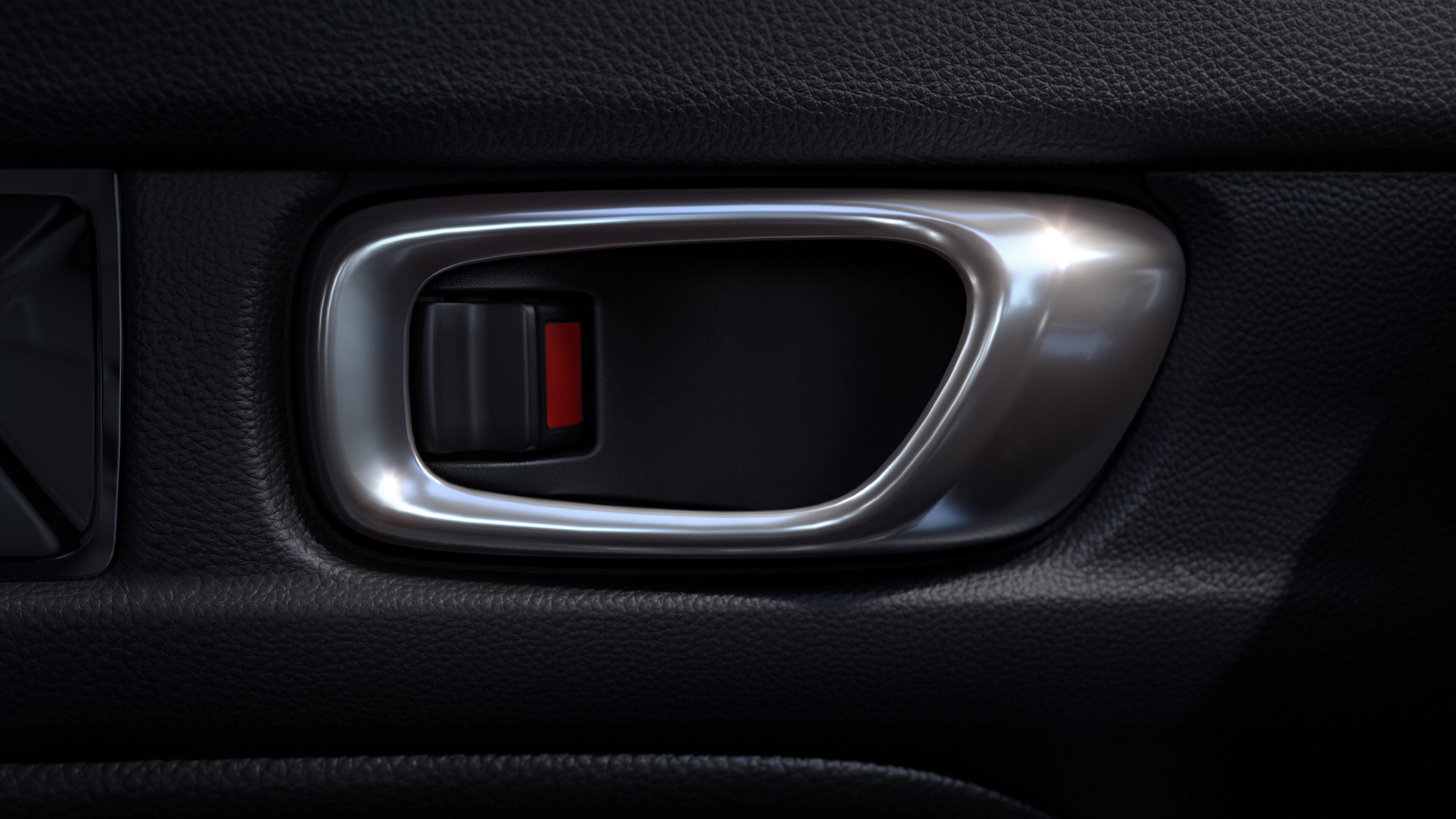 Close-up of silver-coloured Honda Civic Hatchback doorhandle against a black interior
